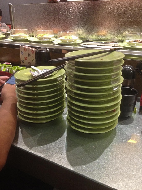 Kaiten sushi. Each plate costs NT$30/US$1 and carries about two pieces of sushi, depending on what kind.